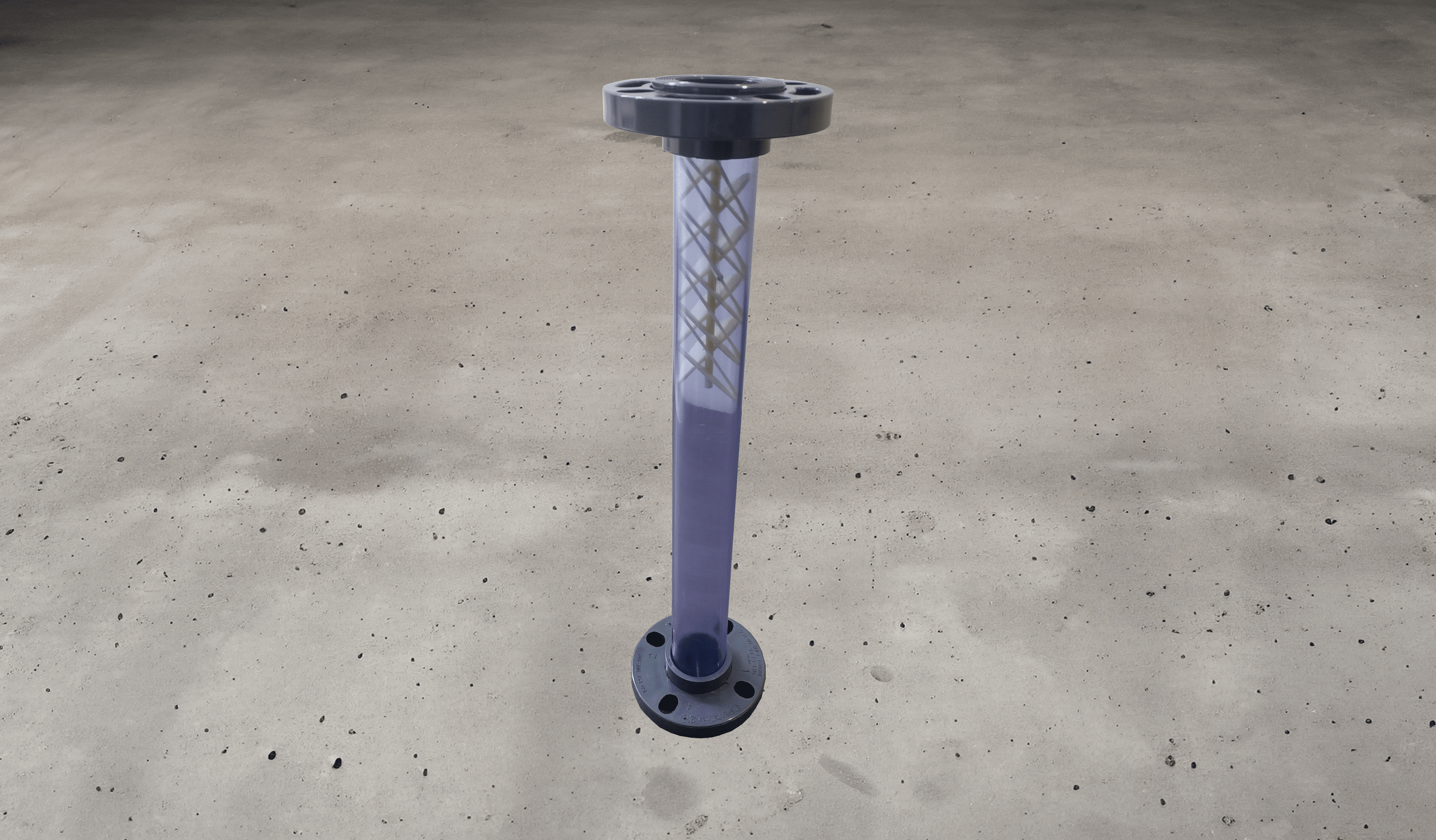Static mixer with baffles inside it visible. Mixer is made of clear PVC.